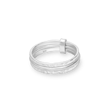Set of three sterling silver rings with hammered texture on white background
