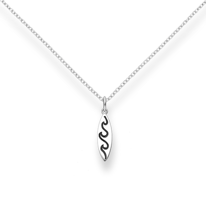 Silver necklace with a wave and surfboard-shaped pendant on a white background